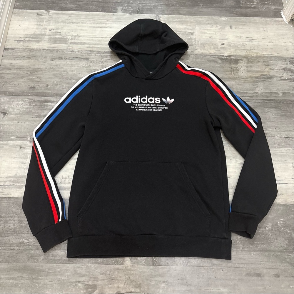 Adidas Originals black hoodie with red, white, and blue striped sleeves